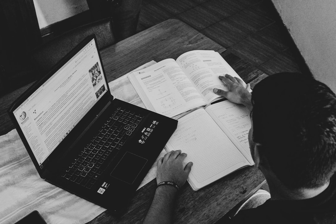 college financial aid application, student studying with laptop and documents