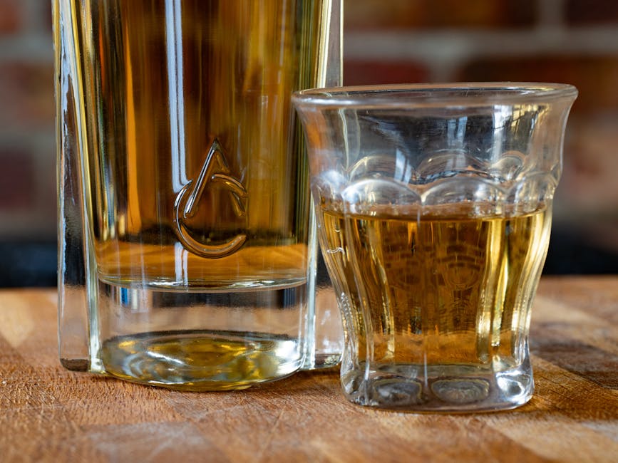 Glenmorangie Original 10 year bottle close up, whisky glass nosing amber liquid